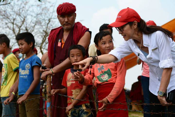 Michelle Yeoh with local kids of Thaple village during her recent visit to Nepal.